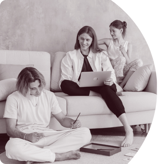 family sitting on a sofa viewing papers