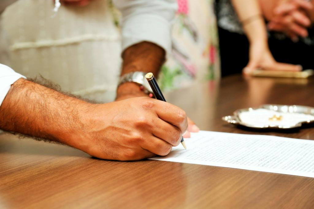 Close-up of hands signing a legal will document in Canada with a witness present
