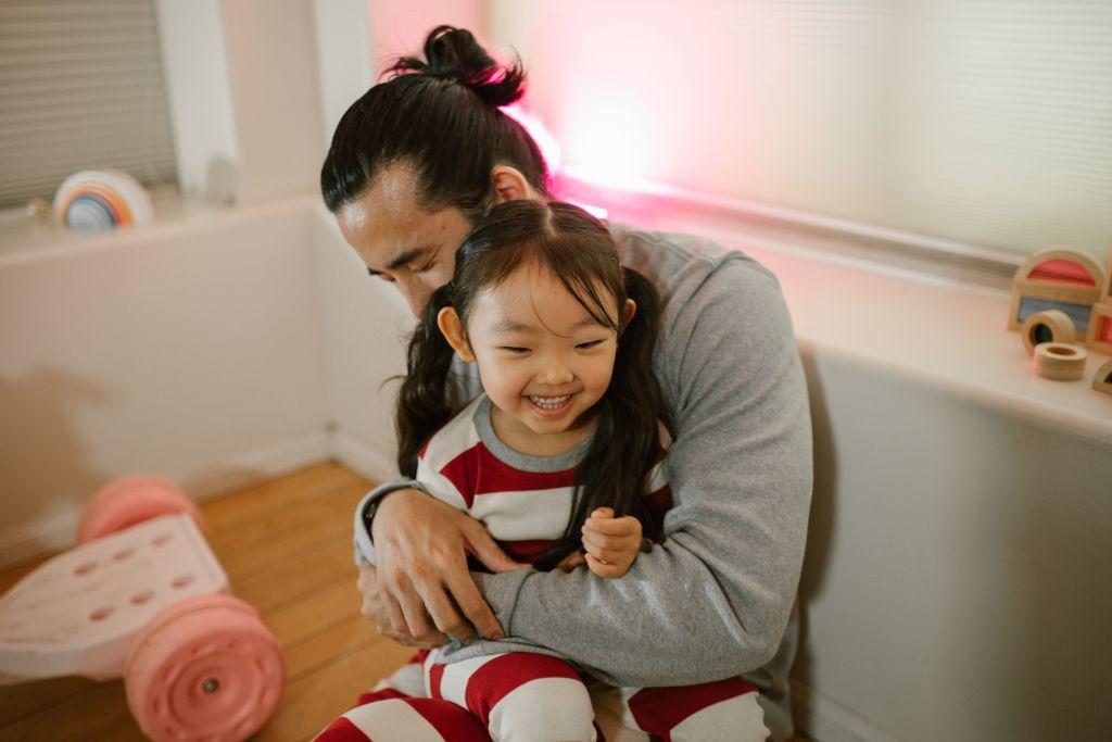 Parent and child sharing a warm moment at home in Canada