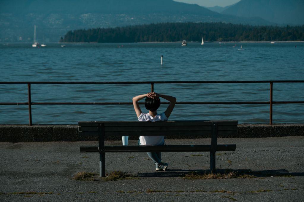 British Columbia resident writing a will at home with mountain view