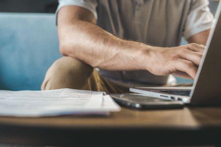 Person creating a legal online will in Canada on a laptop at home