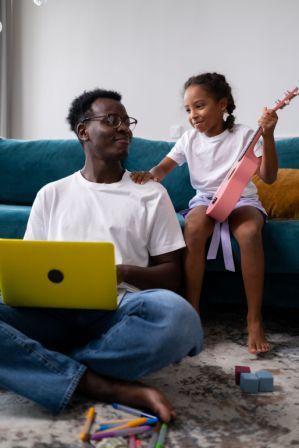 Canadian parent completing their will online while child plays nearby