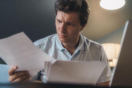 BC resident carefully reviewing a free will template at their desk