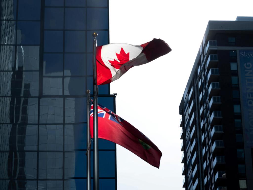 Canadian and Ontario flags flying together representing free will kit options for Ontario residents