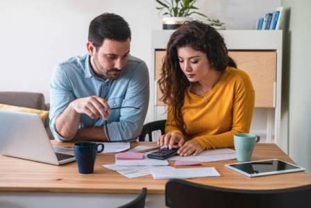 Person organizing documents and information to prepare for writing a Canadian will